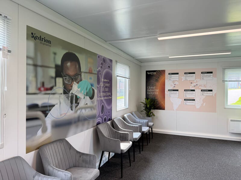 An image of wall graphics showing a scientist working in a lab.